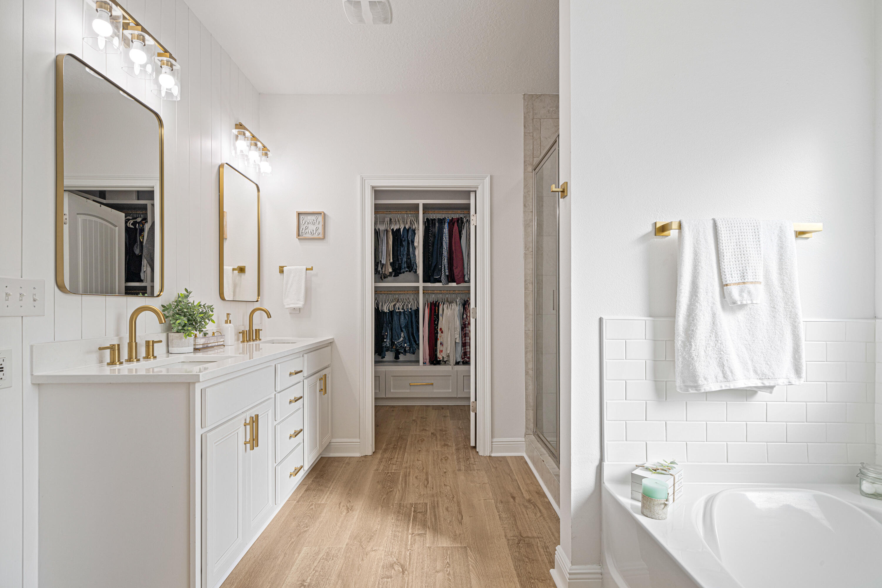52 Conner Circle, Unit LOT 164 Santa Rosa Beach, FL 32459 - Photo 23 of 50 a bathroom with a double vanity sink a mirror and a bathtub