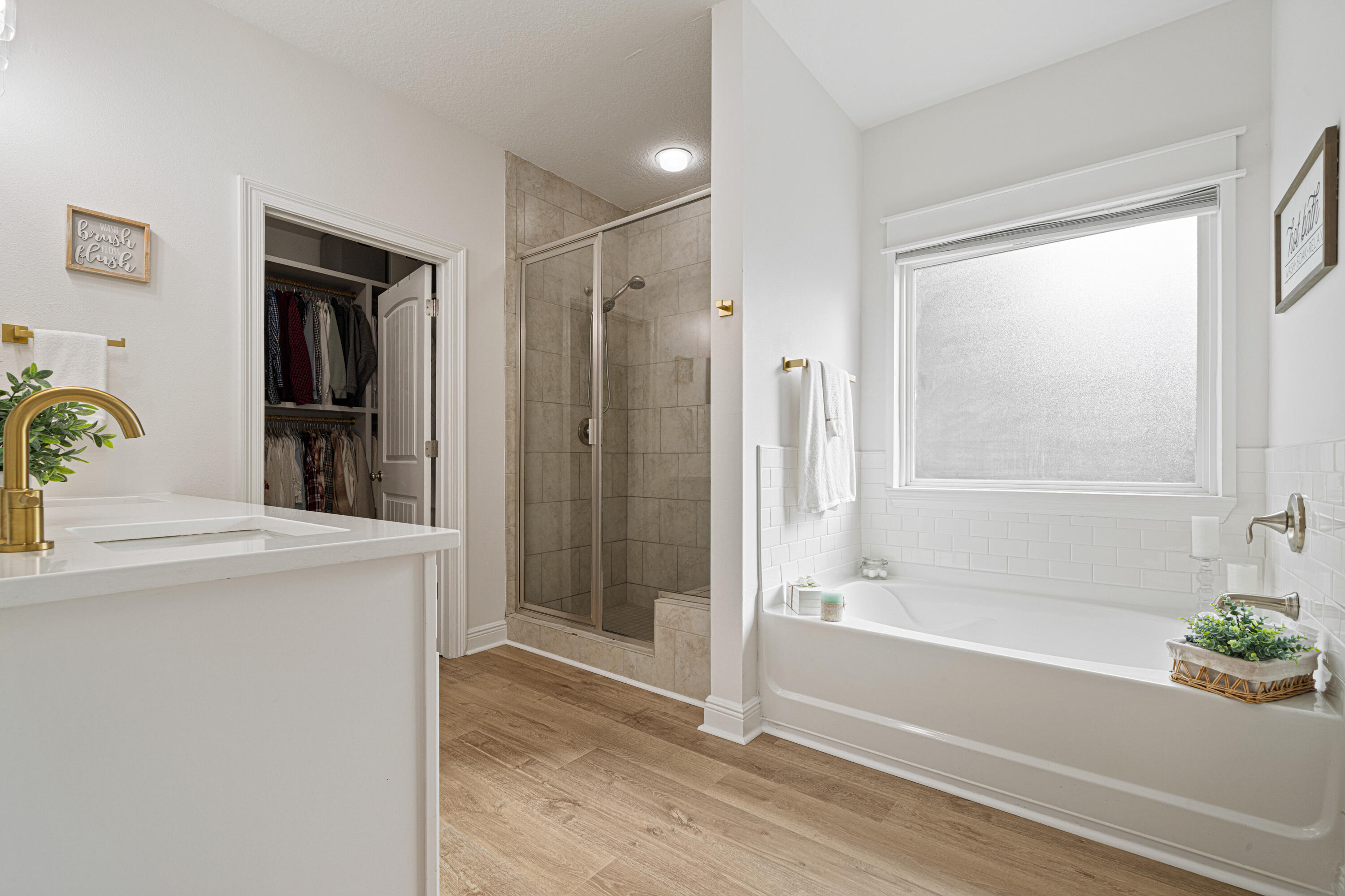 52 Conner Circle, Unit LOT 164 Santa Rosa Beach, FL 32459 - Photo 24 of 50 a bathroom with a tub shower and sink