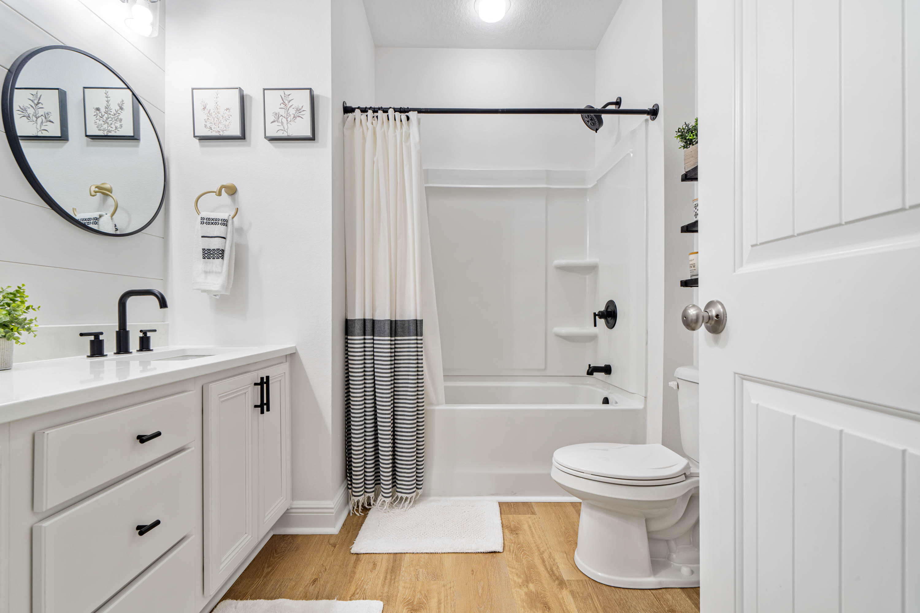 52 Conner Circle, Unit LOT 164 Santa Rosa Beach, FL 32459 - Photo 34 of 50 a bathroom with a toilet sink a shower curtain and a mirror