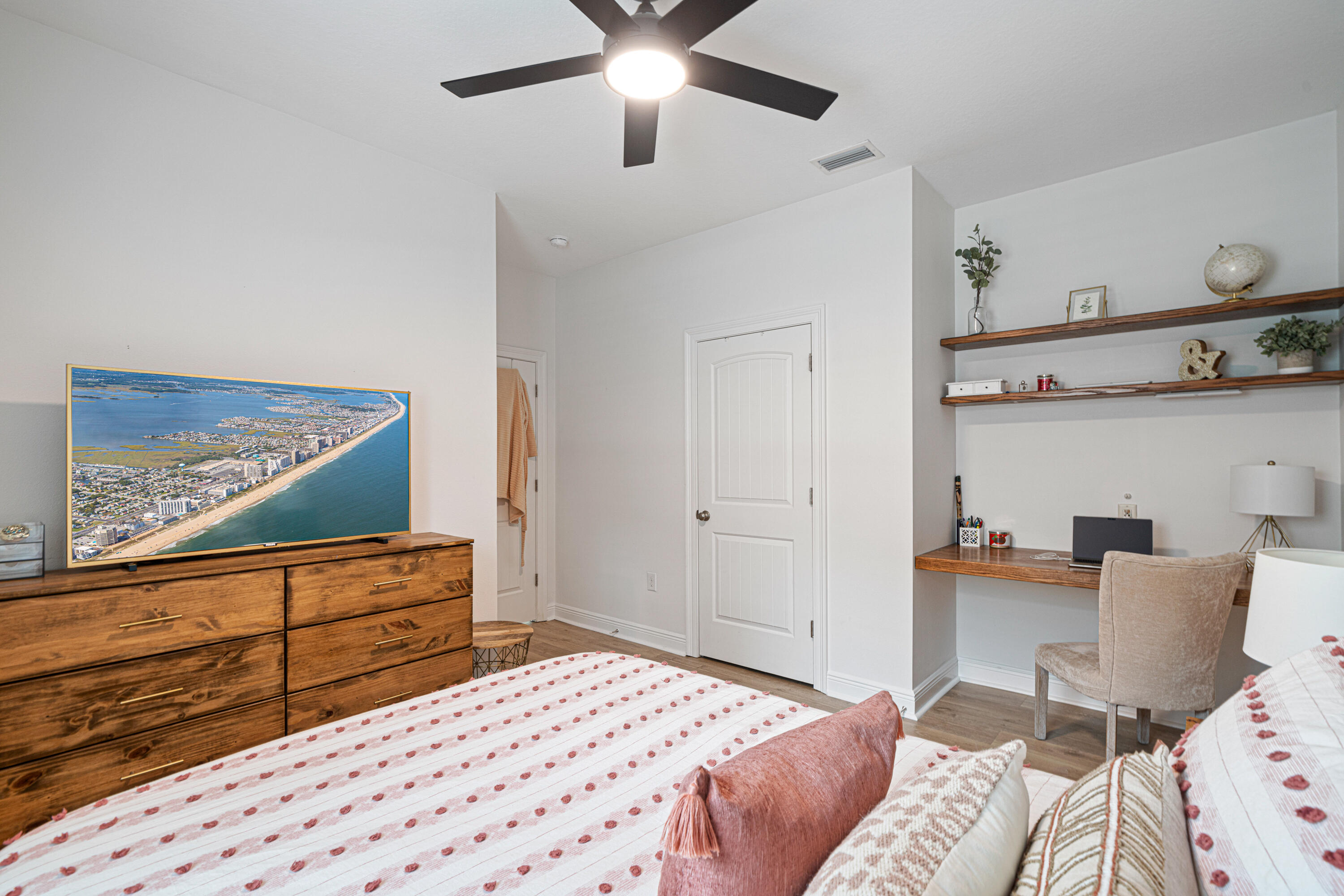 52 Conner Circle, Unit LOT 164 Santa Rosa Beach, FL 32459 - Photo 40 of 50 a bedroom with a bed and wooden floor