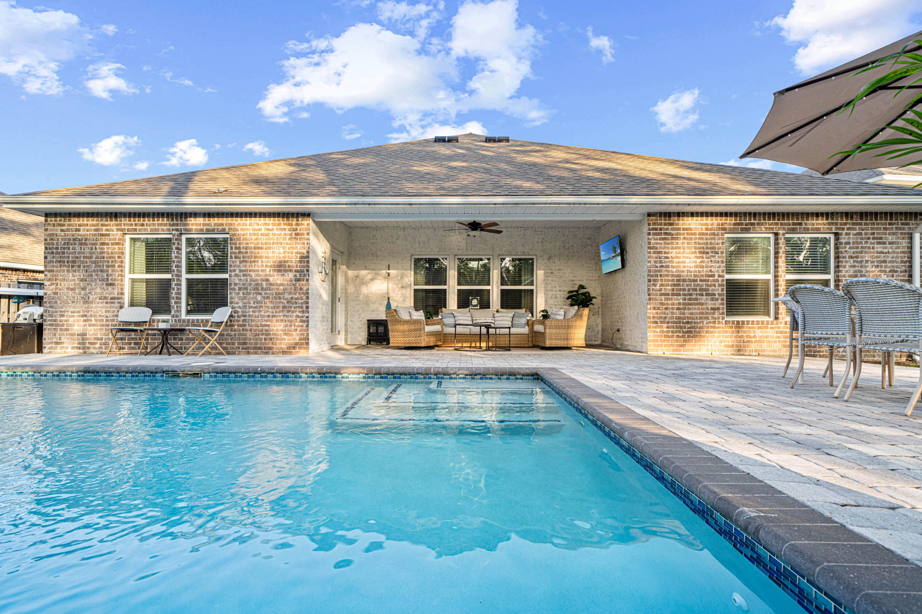 52 Conner Circle, Unit LOT 164 Santa Rosa Beach, FL 32459 - Photo 4 of 50 a view of a living room with chandelier fan and kitchen view