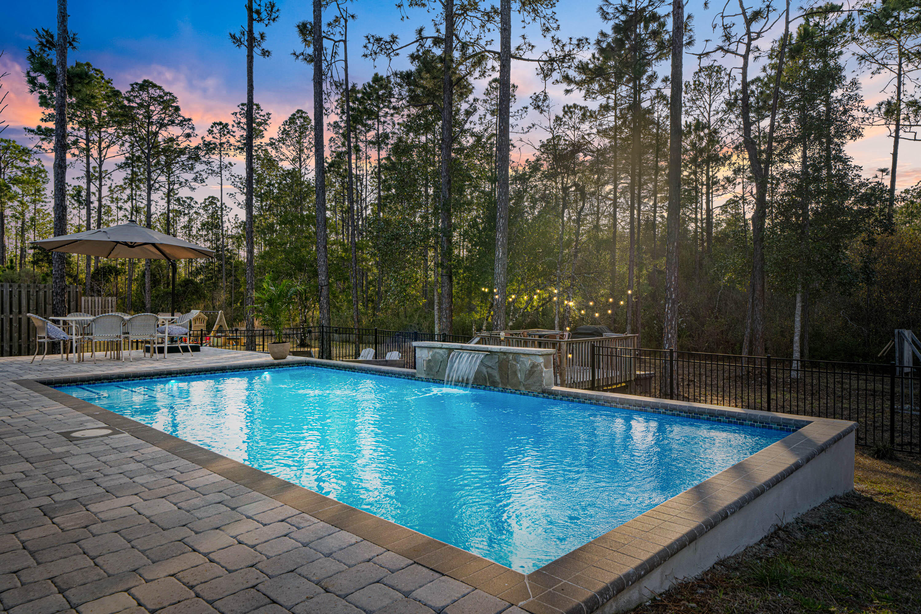 52 Conner Circle, Unit LOT 164 Santa Rosa Beach, FL 32459 - Photo 47 of 50 a view of a swimming pool with an outdoor seating