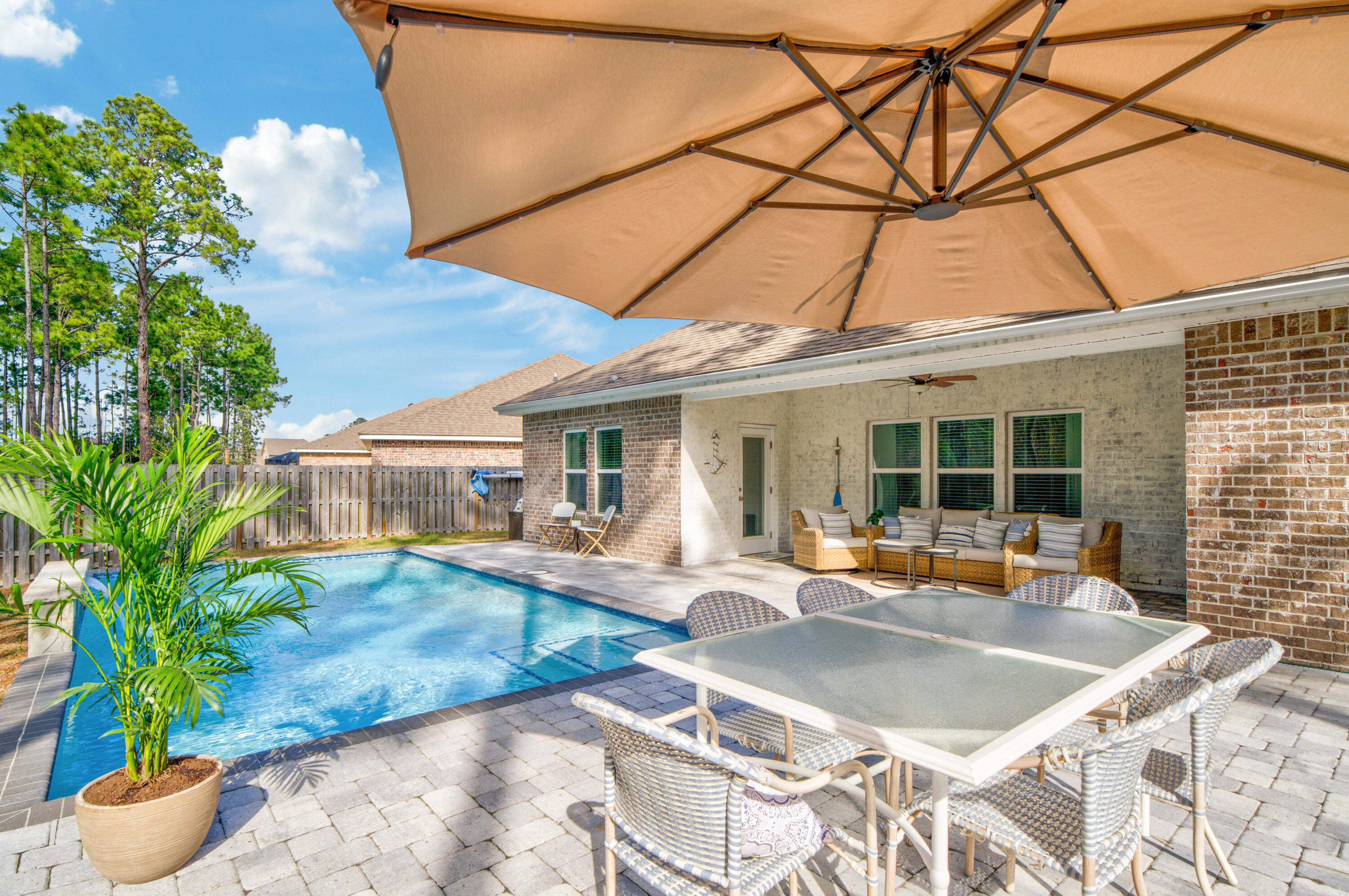 52 Conner Circle, Unit LOT 164 Santa Rosa Beach, FL 32459 - Photo 5 of 50 a wooden bench sitting in front of a house