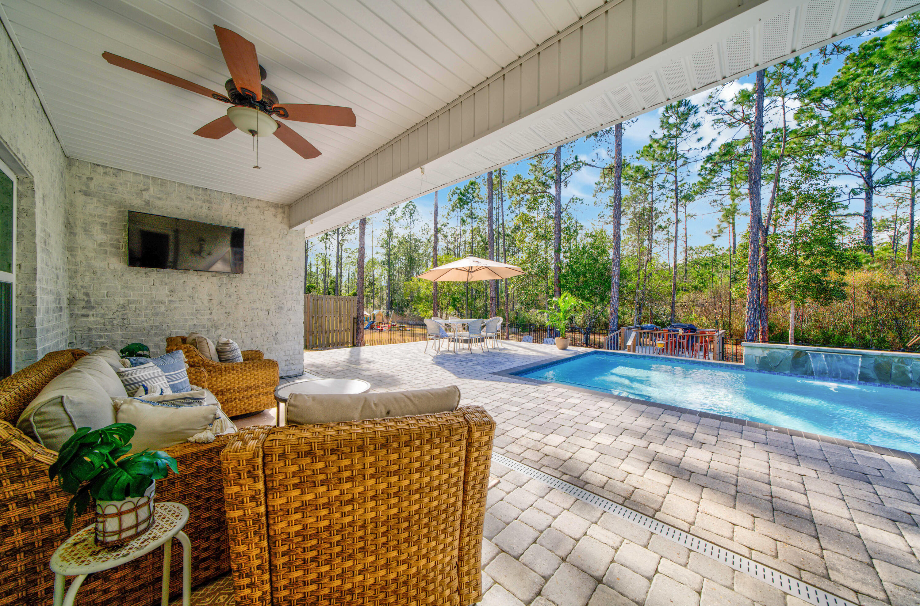 52 Conner Circle, Unit LOT 164 Santa Rosa Beach, FL 32459 - Photo 6 of 50 a living room with patio furniture and a floor to ceiling window