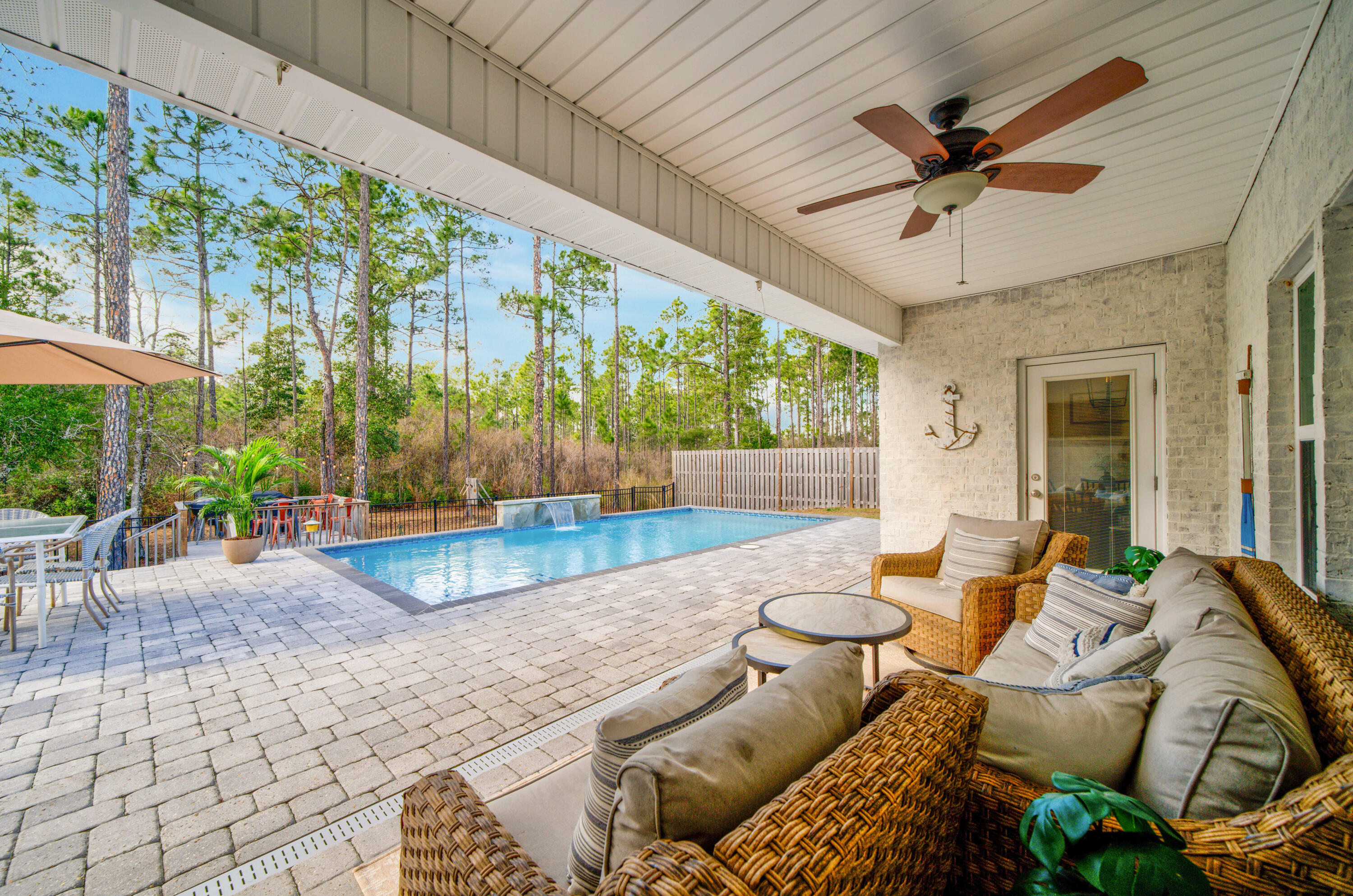 52 Conner Circle, Unit LOT 164 Santa Rosa Beach, FL 32459 - Photo 8 of 50 a view of a patio with a dining table and chairs