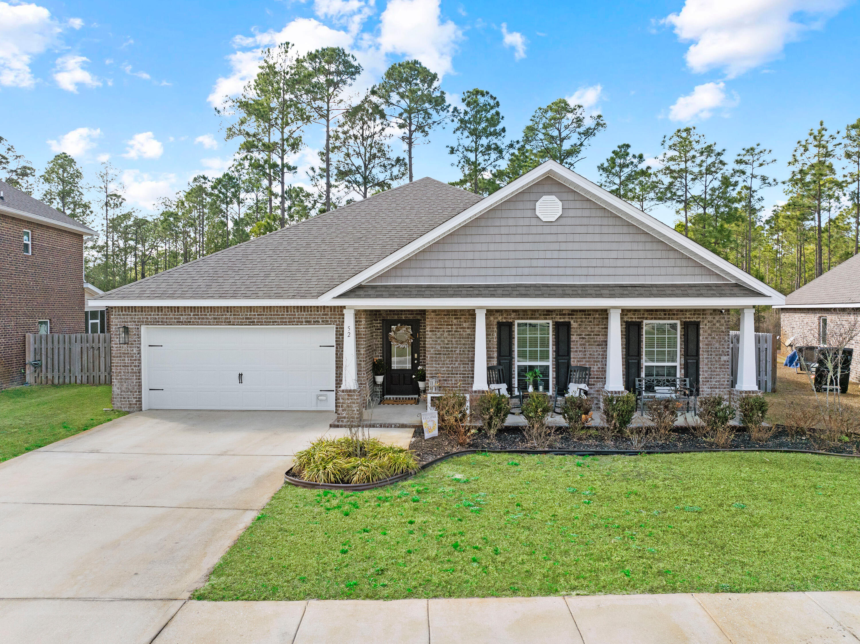 52 Conner Circle, Unit LOT 164 Santa Rosa Beach, FL 32459 - Photo 9 of 50 a front view of a house with garden