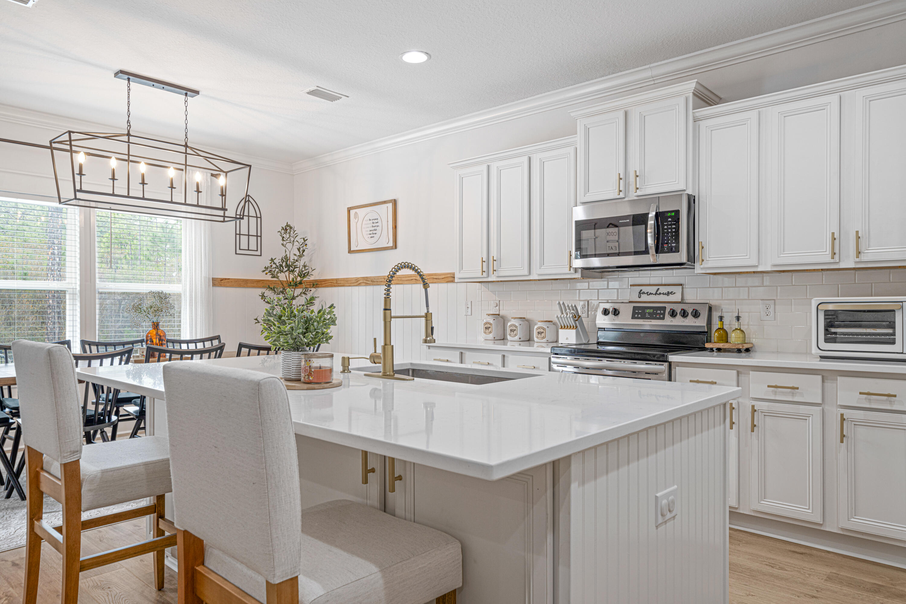 52 Conner Circle, Unit LOT 164 Santa Rosa Beach, FL 32459 - Photo 10 of 50 a kitchen with a stove a sink a microwave and cabinets