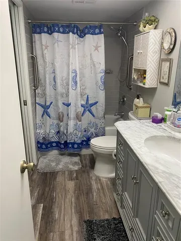 a bedroom with a bed mirror and a window