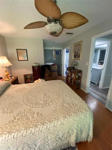 a bedroom with a bed and a mirror