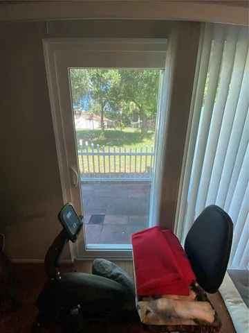 a view of a patio with furniture and a yard