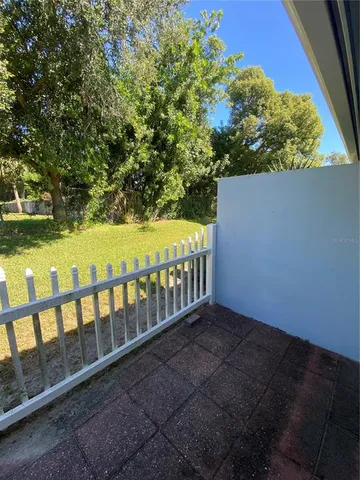 a view of a balcony with an outdoor space and seating