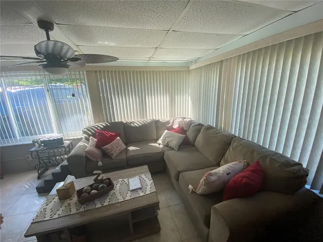a living room with furniture and a window