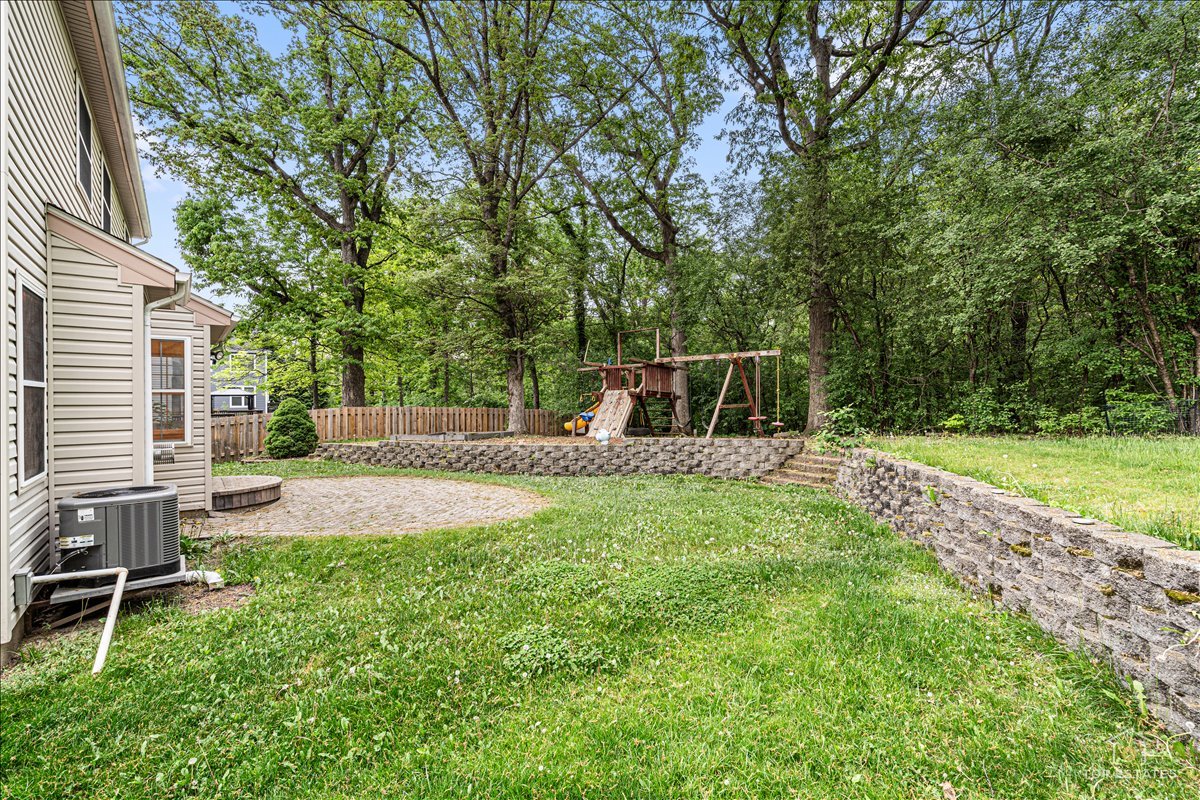 7 Eagle Court Streamwood, IL 60107 - Photo 30 of 31 a view of a backyard with a sitting area
