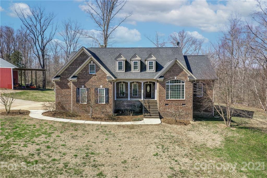 2460 State Rd S-46-883 York, SC 29745 - Photo 1 of 48 a front view of a house with garden