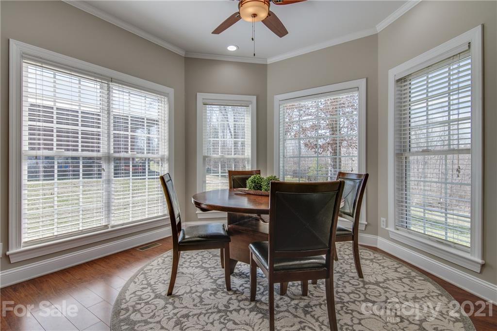 2460 State Rd S-46-883 York, SC 29745 - Photo 14 of 48 a dining room with furniture window and wooden floor