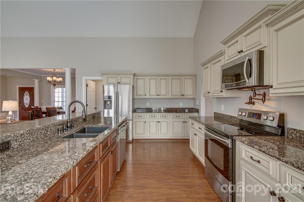 2460 State Rd S-46-883 York, SC 29745 - Photo 15 of 48 a kitchen with granite countertop lots of counter top space and stainless steel appliances