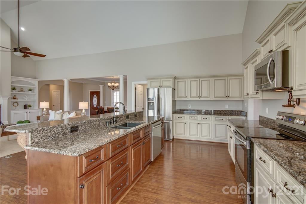 2460 State Rd S-46-883 York, SC 29745 - Photo 16 of 48 a kitchen with stainless steel appliances granite countertop a stove and a sink