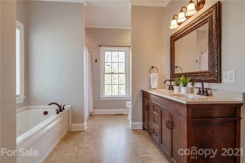 2460 State Rd S-46-883 York, SC 29745 - Photo 21 of 48 a spacious bathroom with a tub sink and mirror