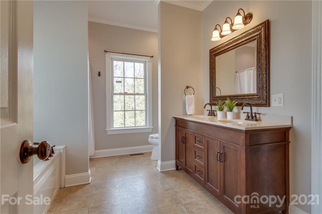 2460 State Rd S-46-883 York, SC 29745 - Photo 22 of 48 a bathroom with a double vanity sink mirror and