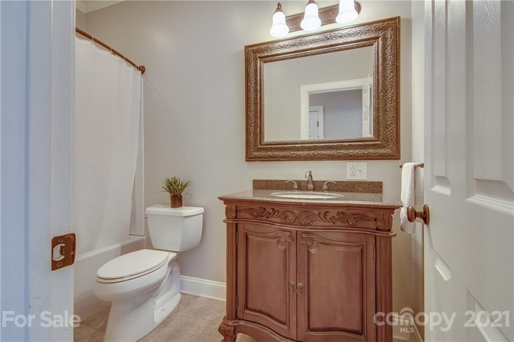 2460 State Rd S-46-883 York, SC 29745 - Photo 32 of 48 a bathroom with a toilet a sink and a mirror
