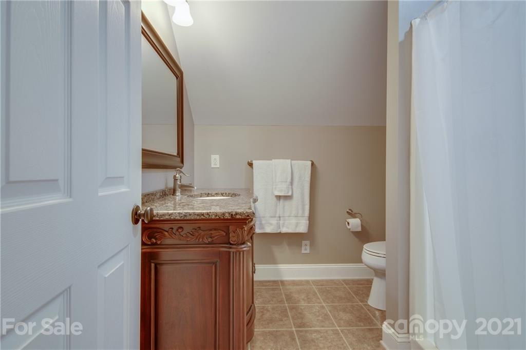 2460 State Rd S-46-883 York, SC 29745 - Photo 38 of 48 a bathroom with a granite countertop sink a toilet and a mirror