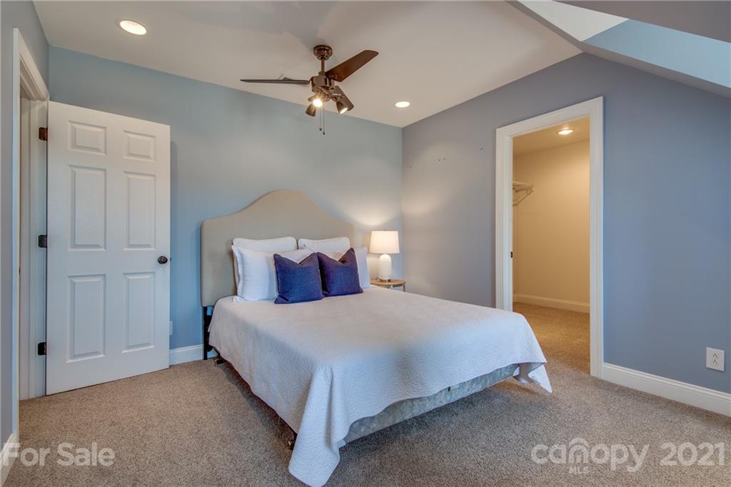 2460 State Rd S-46-883 York, SC 29745 - Photo 40 of 48 a bedroom with a bed and a chandelier
