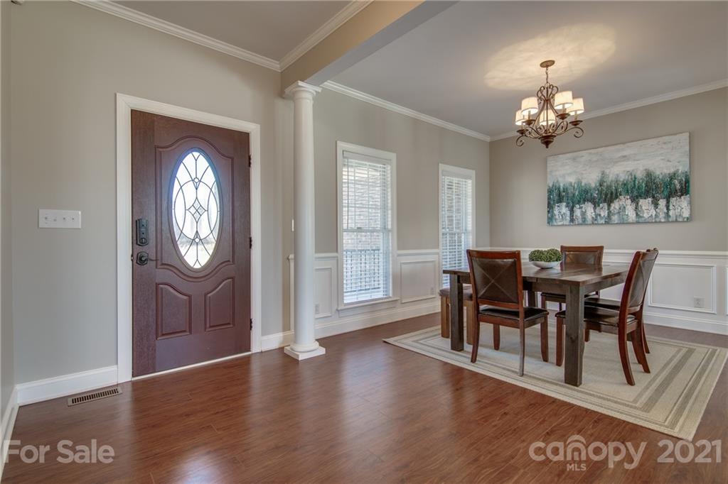 2460 State Rd S-46-883 York, SC 29745 - Photo 6 of 48 a view of a dining room with furniture a chandelier and wooden floor