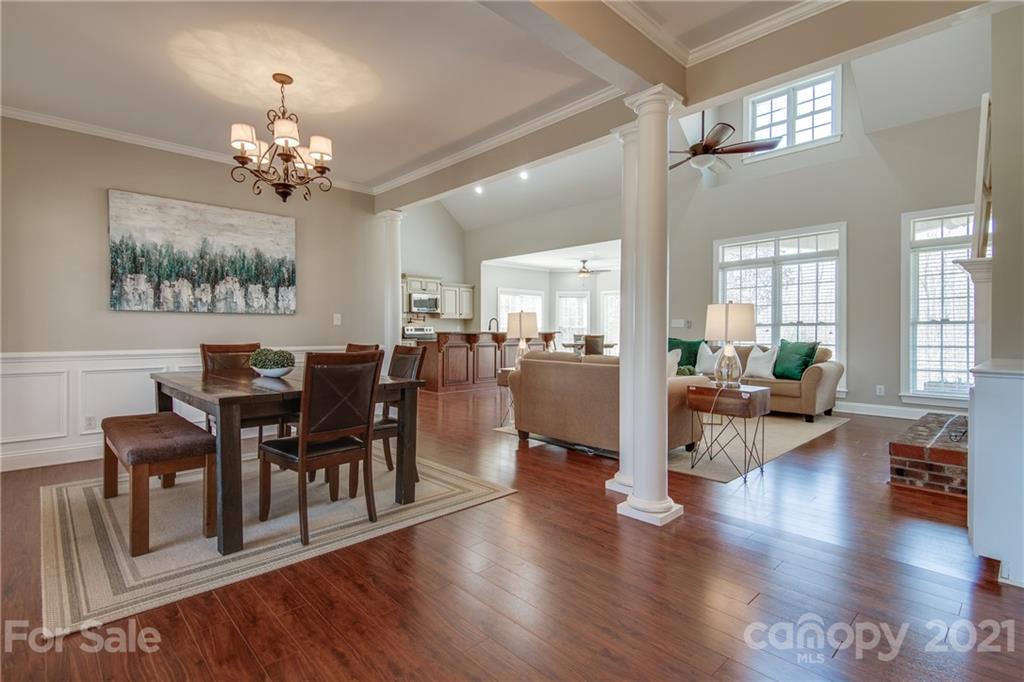 2460 State Rd S-46-883 York, SC 29745 - Photo 8 of 48 a view of a dining room and livingroom with furniture wooden floor a chandelier