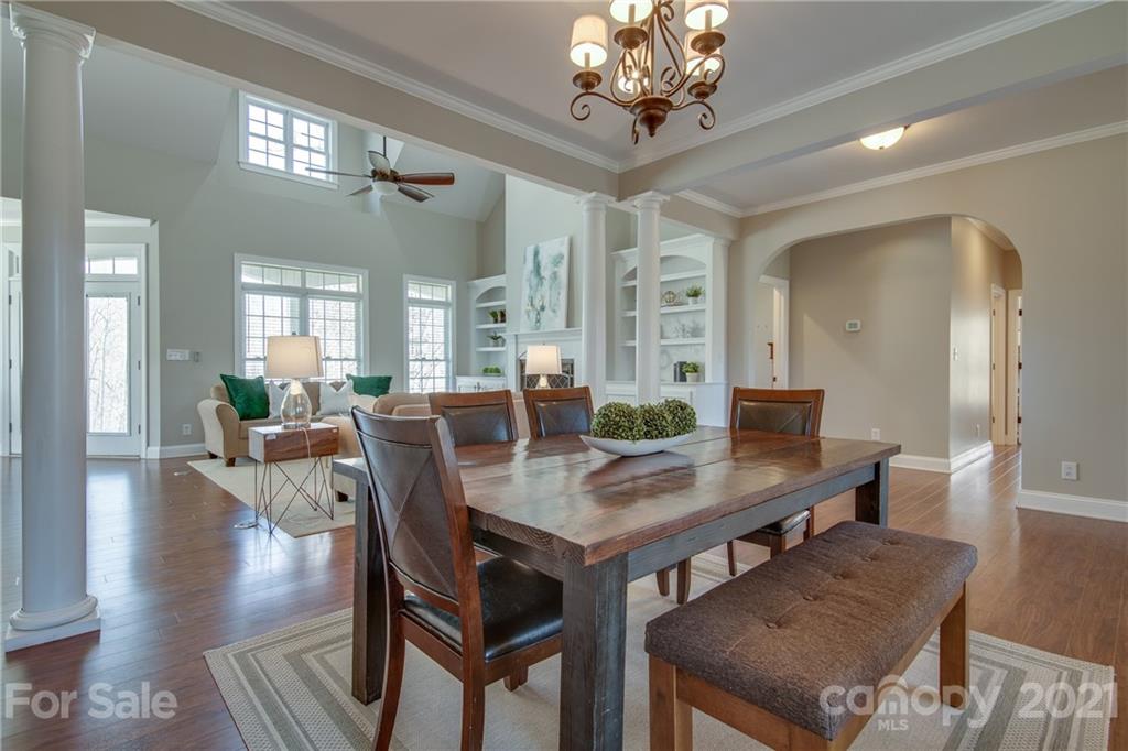 2460 State Rd S-46-883 York, SC 29745 - Photo 9 of 48 a view of a dining room with furniture a chandelier and wooden floor