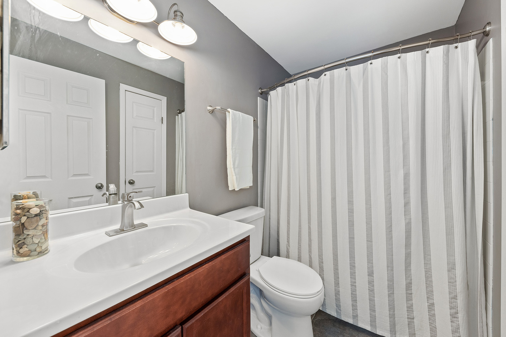 1344 McDowell Road, Unit 101 Naperville, IL 60563 - Photo 14 of 19 a bathroom with a sink and a mirror