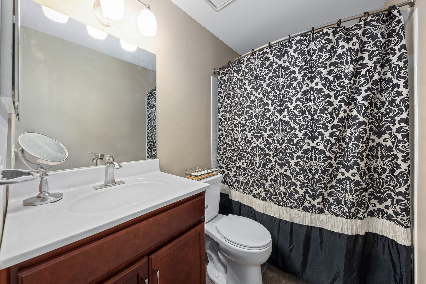 1344 McDowell Road, Unit 101 Naperville, IL 60563 - Photo 16 of 19 a bathroom with a sink toilet and a mirror