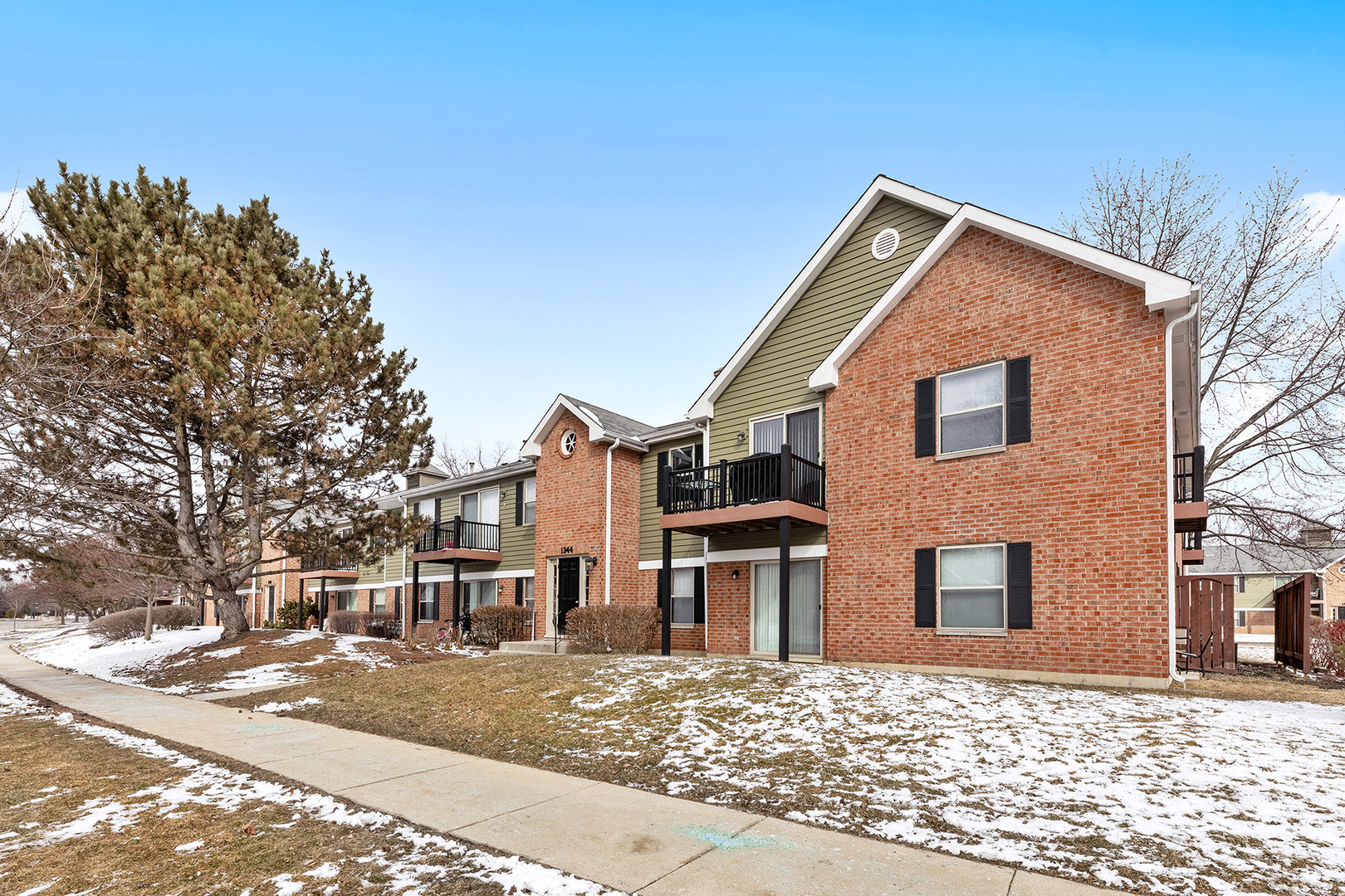 1344 McDowell Road, Unit 101 Naperville, IL 60563 - Photo 18 of 19 a view of a house with a yard