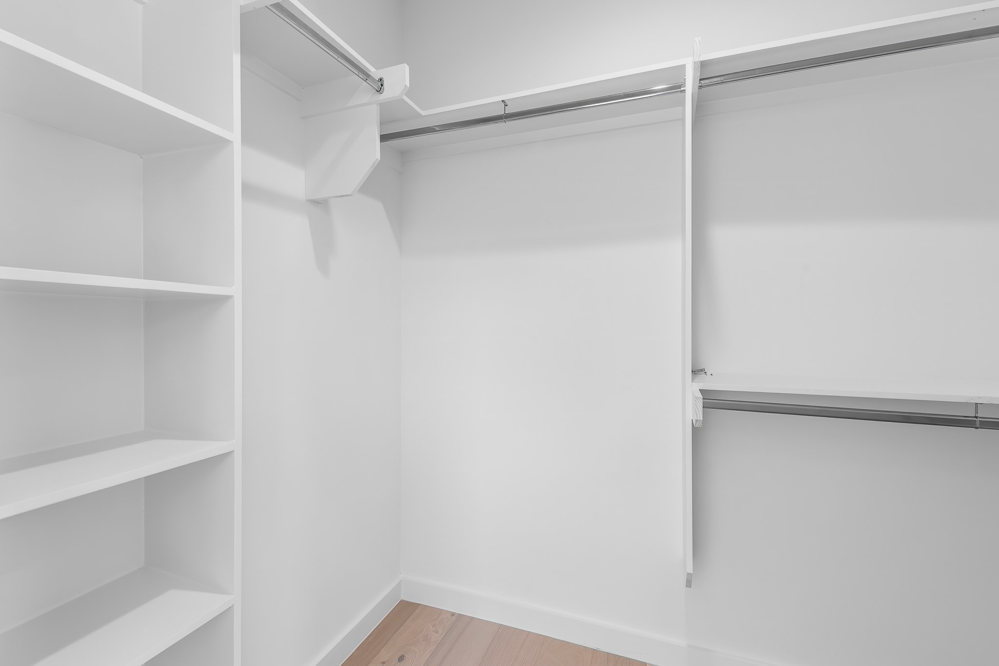 5305 Ledesma Road, Unit 4 Austin, TX 78721 - Photo 30 of 40 Ample shelving and hanging space define this highly organized walk-in closet.
