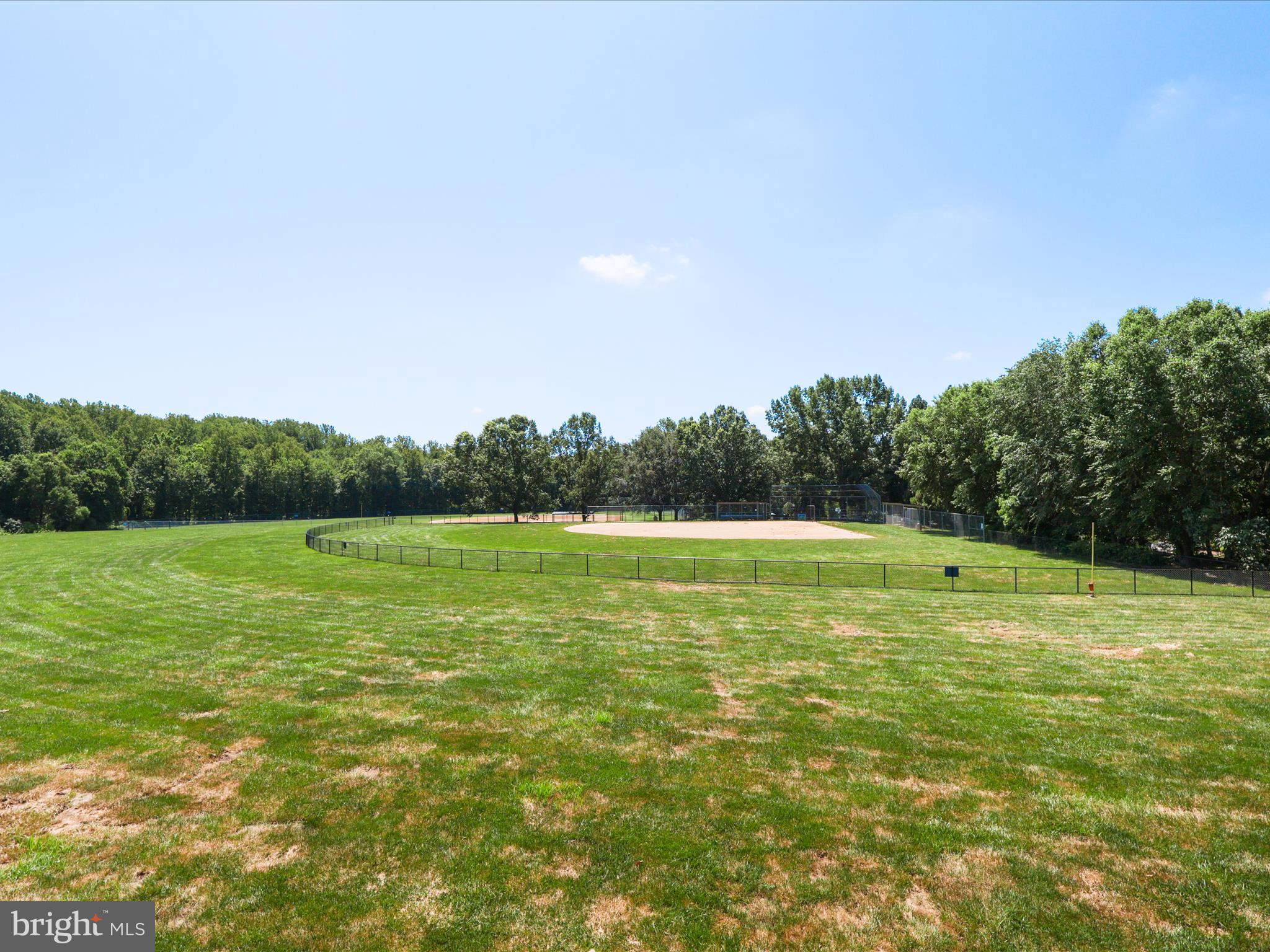 1451 Waterfront Road Reston, VA 20194 - Photo 54 of 76 a view of a green field with trees in the background