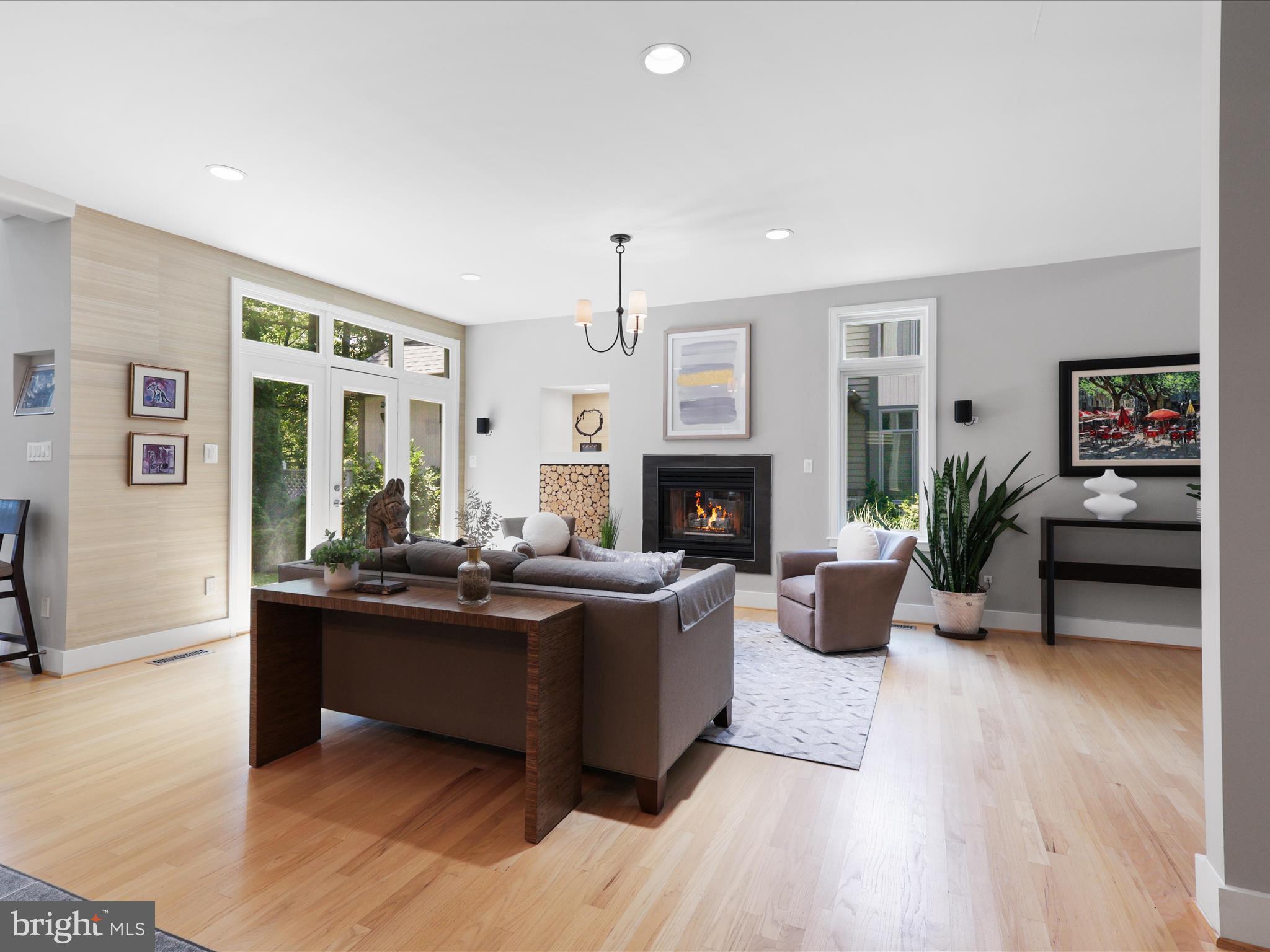1451 Waterfront Road Reston, VA 20194 - Photo 8 of 76 a living room with furniture a large window and a fireplace