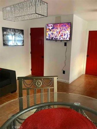 a living room with furniture and painting on the wall