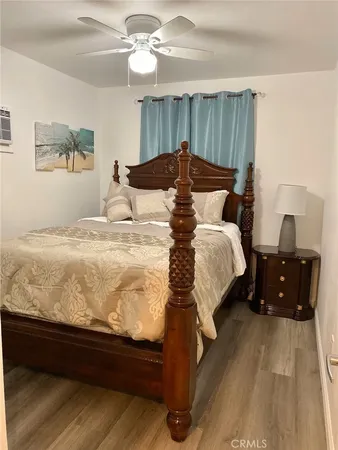 a bedroom with a bed and a dresser