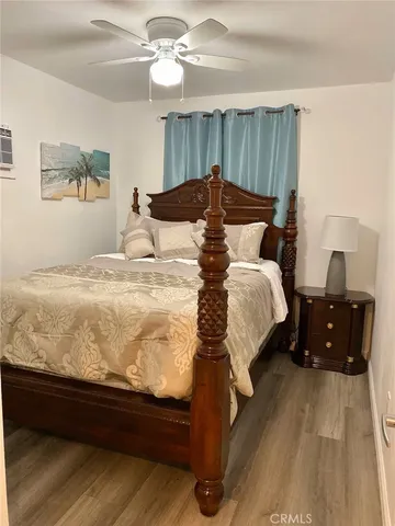 a bedroom with a bed and a dresser