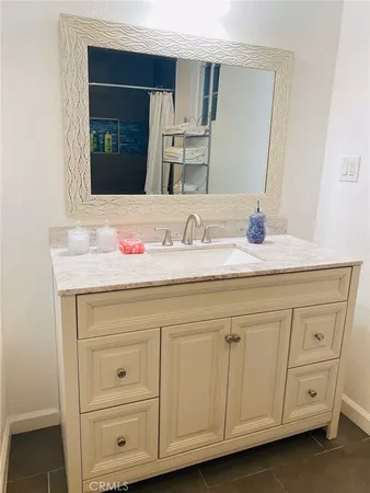 a bathroom with a toilet and a shower curtain