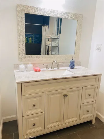 a bathroom with a toilet and a shower curtain