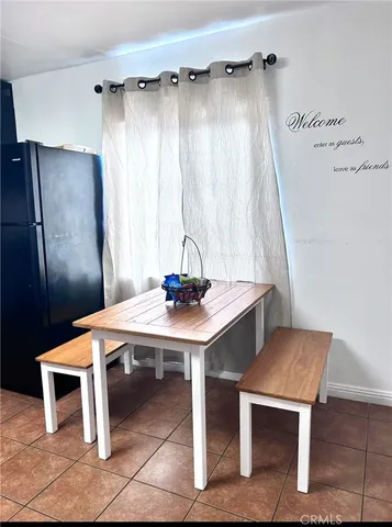 a bedroom with furniture and a flat screen tv