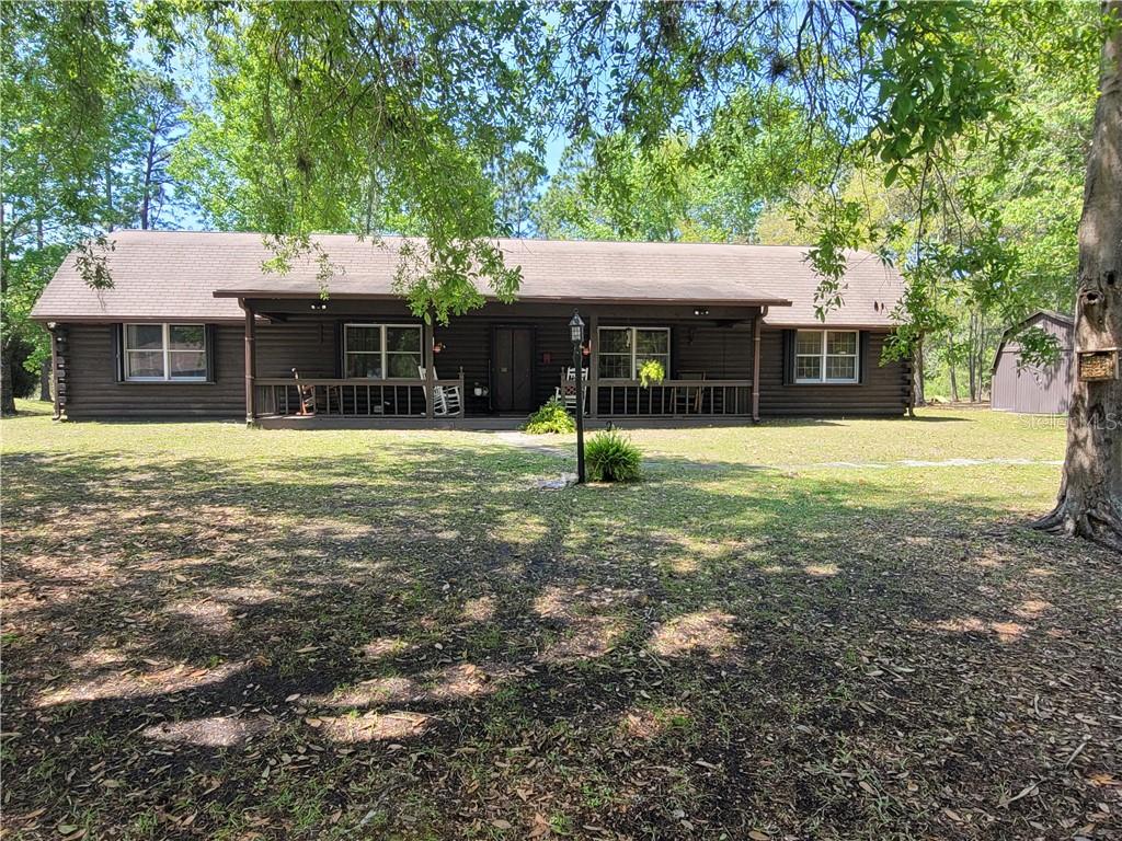 a house with a yard and trees