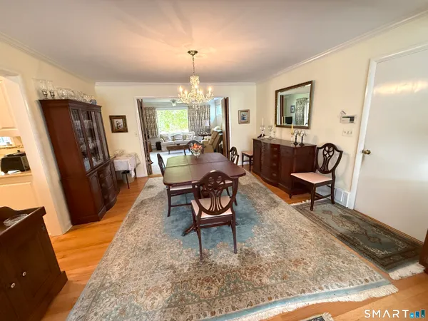 a living room with furniture rug and lamp