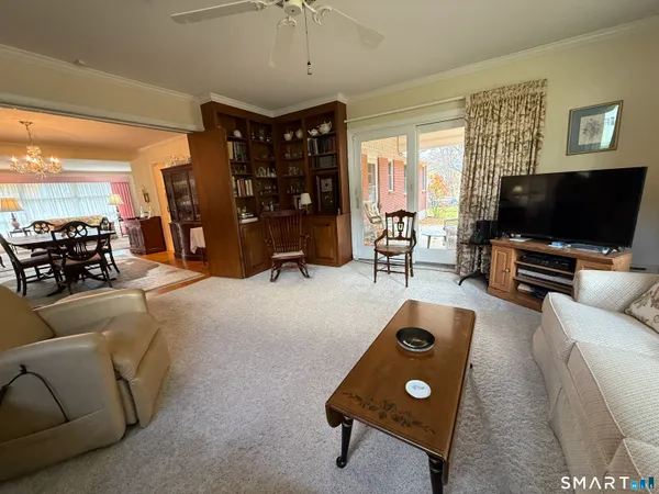 a living room with furniture and a flat screen tv