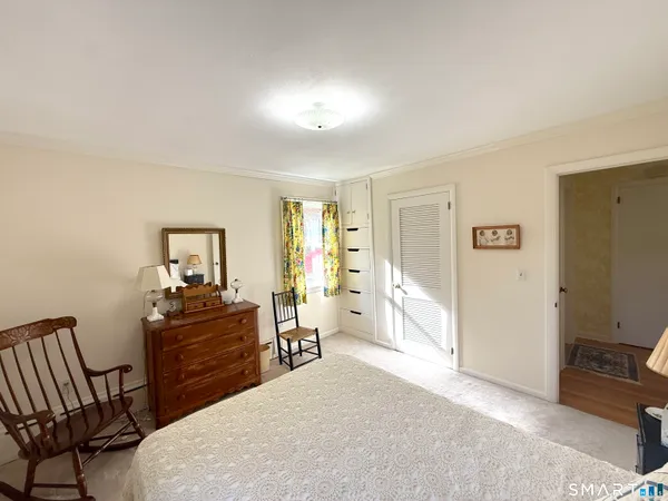 a bedroom with a bed and furniture