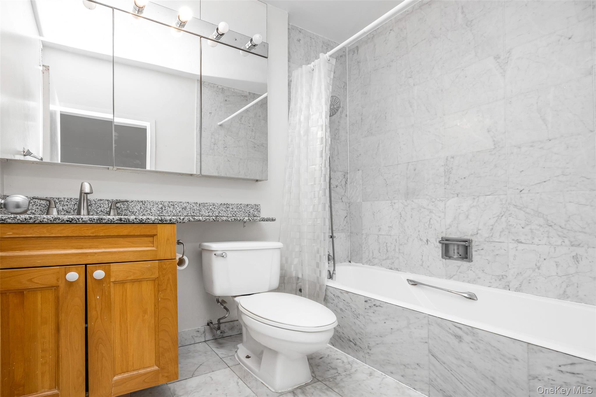 380 Rector Place, Unit 7A Manhattan, NY 10280 - Photo 12 of 19 Full bathroom featuring vanity, tiled shower / bath, and toilet