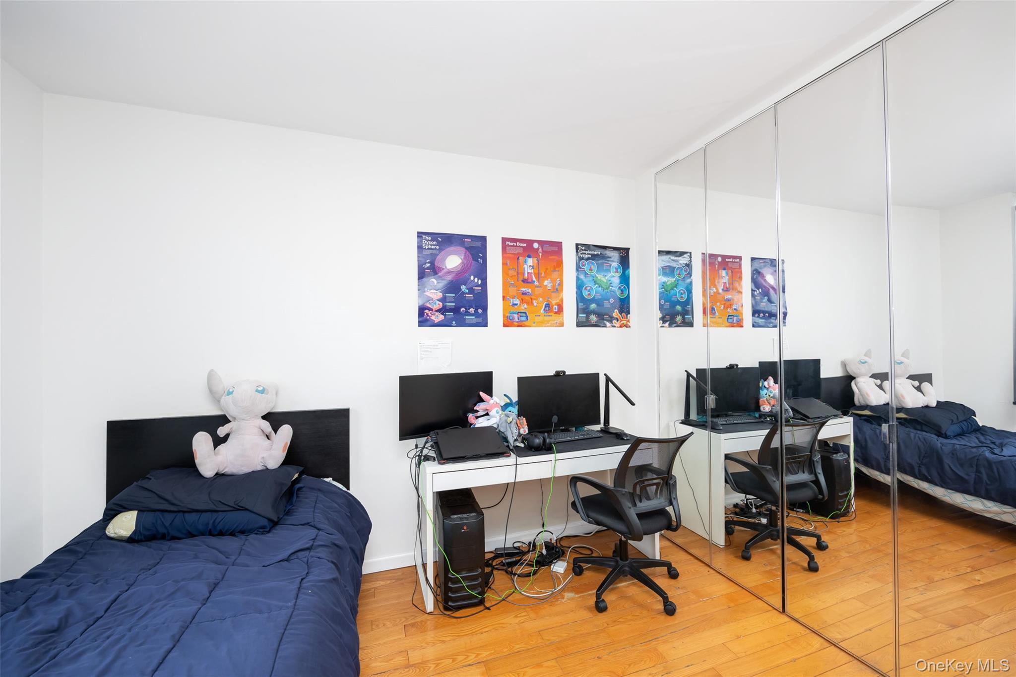 380 Rector Place, Unit 7A Manhattan, NY 10280 - Photo 8 of 19 Bedroom featuring a closet and wood finished floors