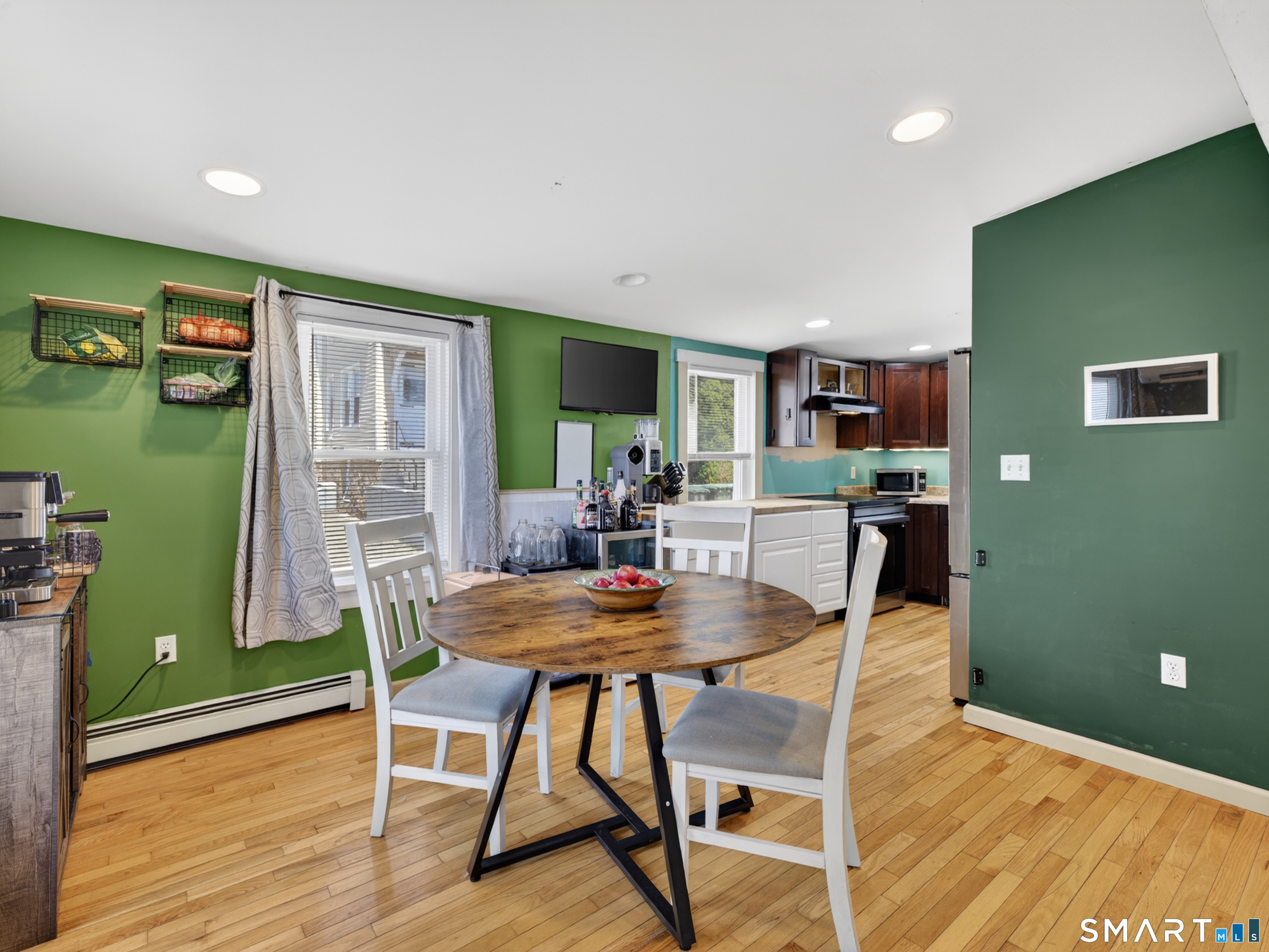 13 Oak Street Groton, CT 06340 - Photo 13 of 38 a view of a dining room with furniture and a kitchen