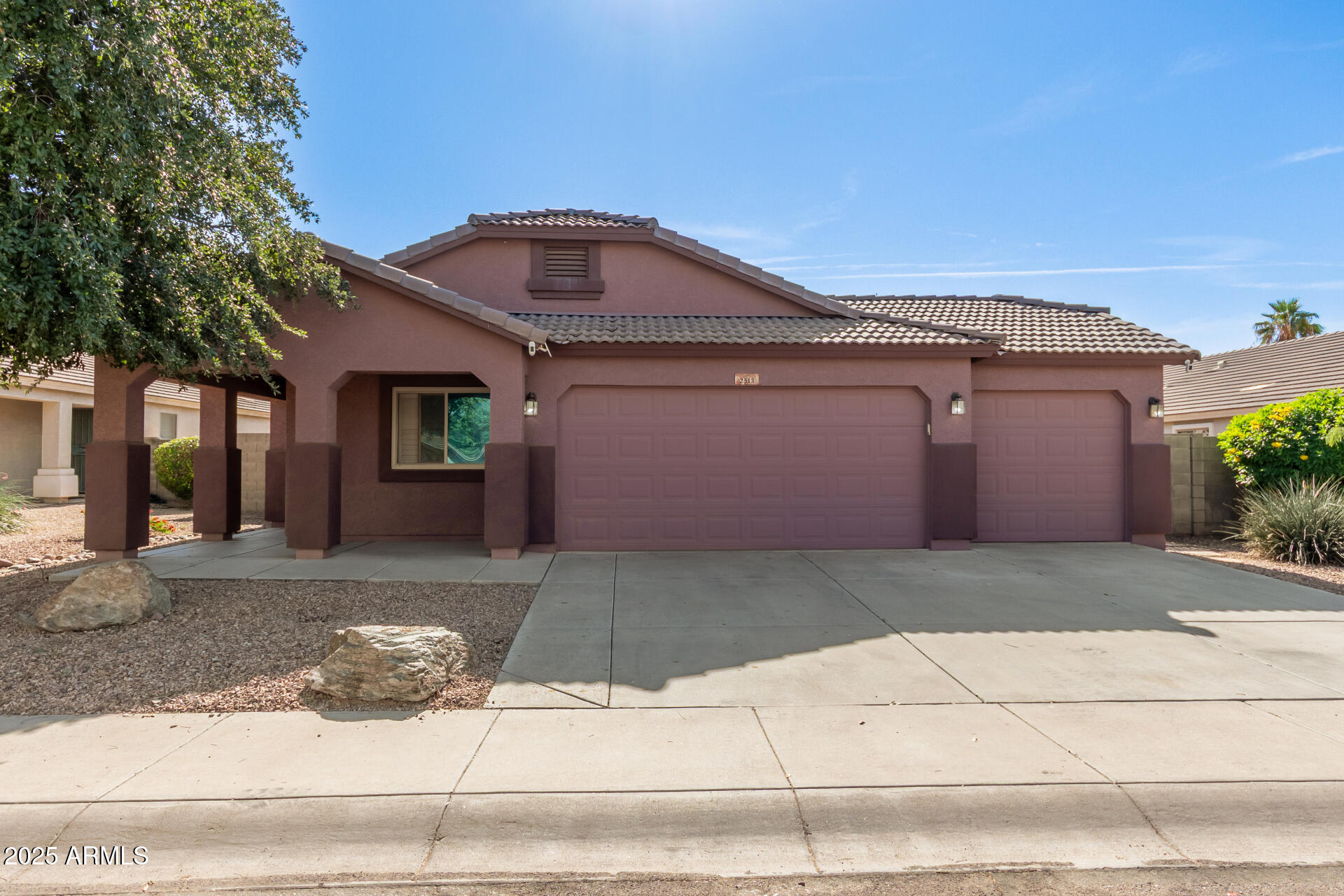 2513 West Carter Road Phoenix, AZ 85041 - Photo 1 of 27 a front view of a house with a yard and garage