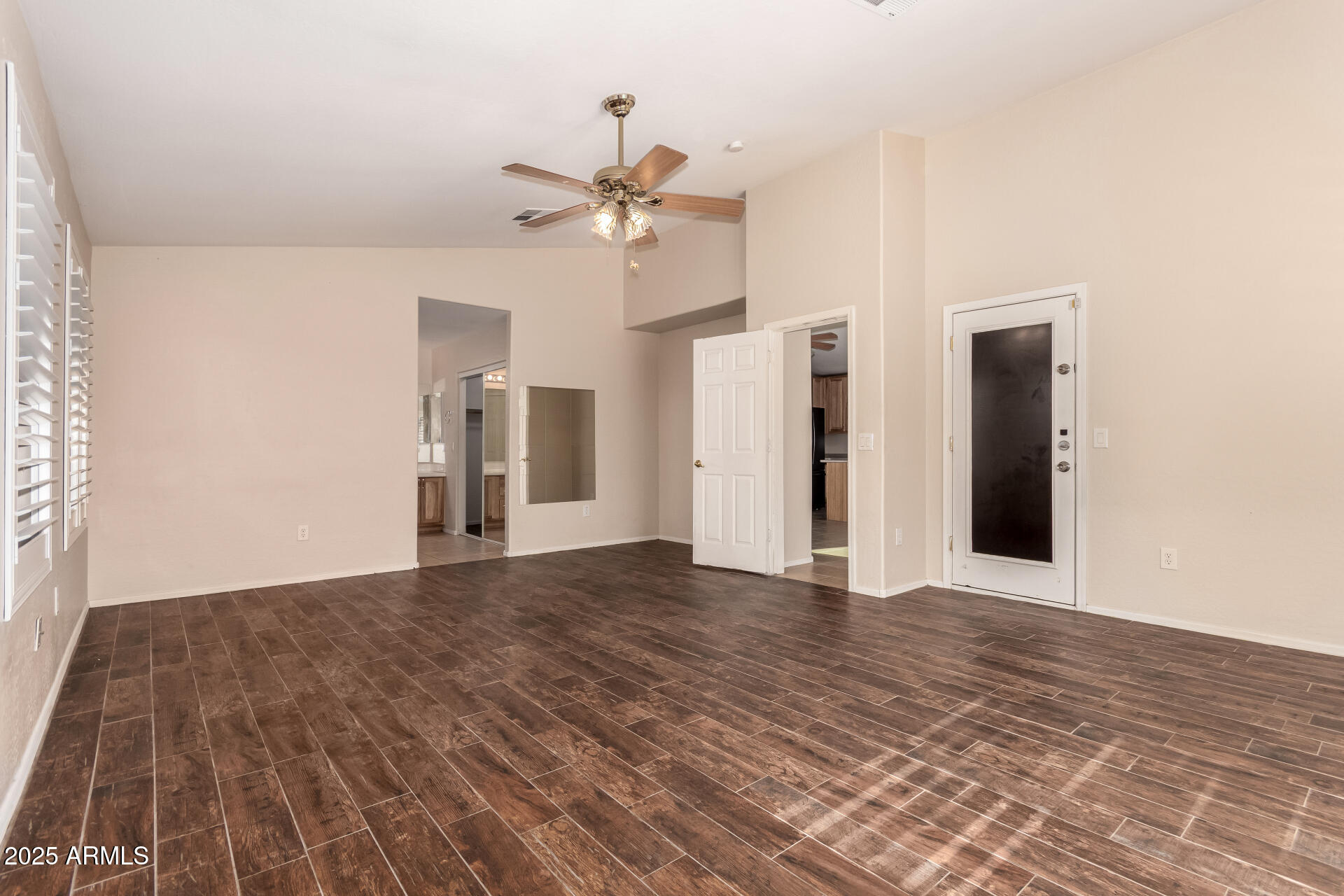 2513 West Carter Road Phoenix, AZ 85041 - Photo 13 of 27 a view of empty room with wooden floor
